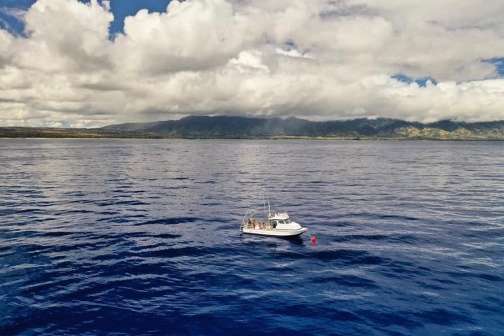 a small boat in a large body of water