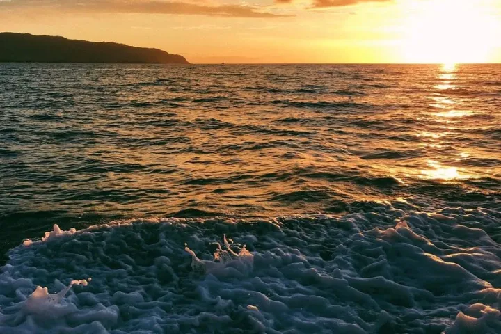 a sunset over a body of water