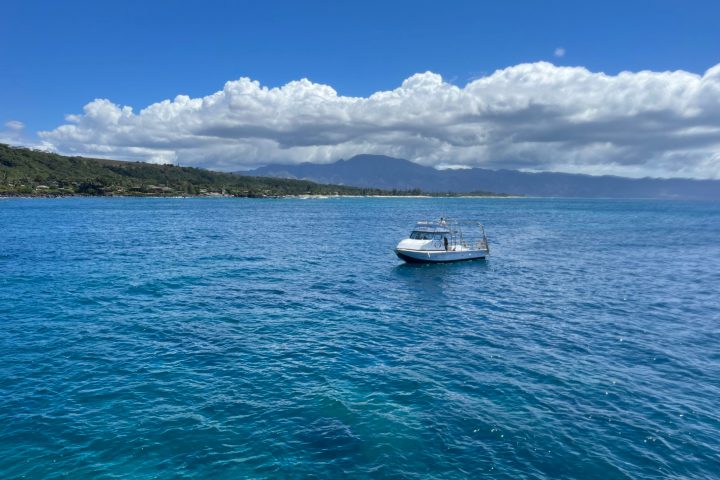 a small boat in a large body of water